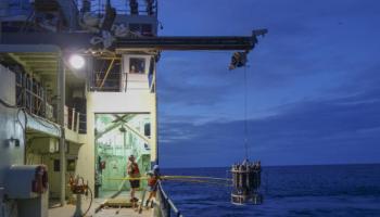 With the help of a marine technician, students retrieve samples of the waters of the South Atlantic for analysis. 