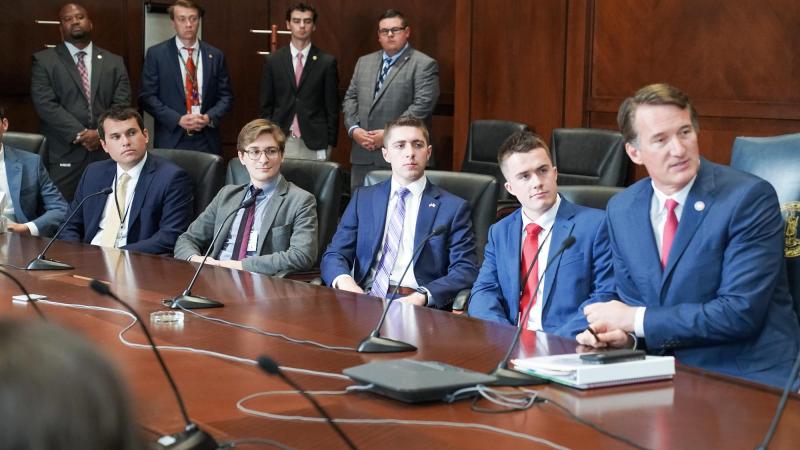 Gov. Glenn Youngkin, right, addresses office staff members. UVA student Cooper Cramer, seated to Youngkin’s right, interned in the Office of Transformation this summer. (Photo by Christian Martinez, Office of Gov. Glenn Youngkin)