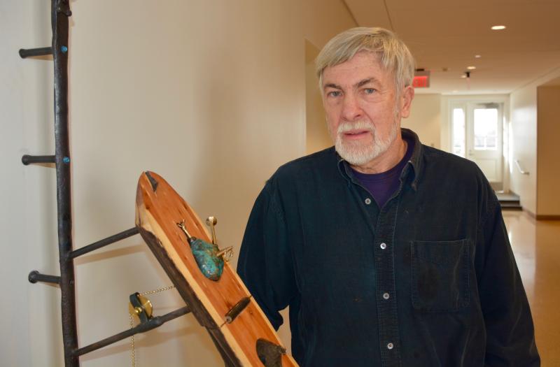 Associate Professor of Art Bill Bennett and his sculpture, \"Eye, Hand, Heart, House\"