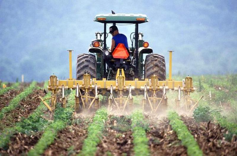 Farm tractor at work